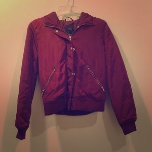 Cranberry colored jacket with fur lined hood.